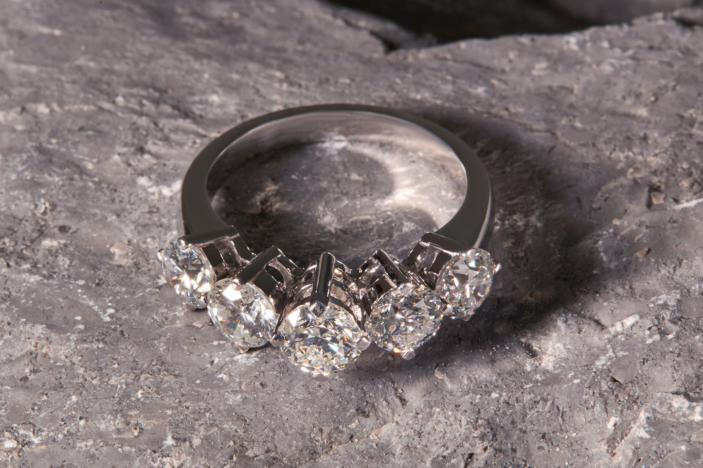 Diamond ring on a textured stone surface